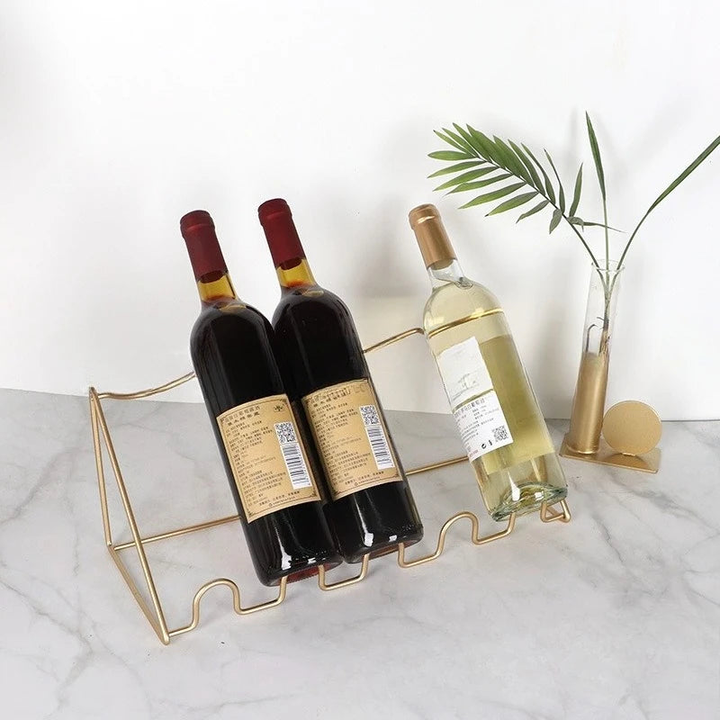 Porte bouteille en fer forgé en doré pour quatre bouteilles 