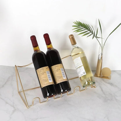 Porte bouteille en fer forgé en doré pour quatre bouteilles 